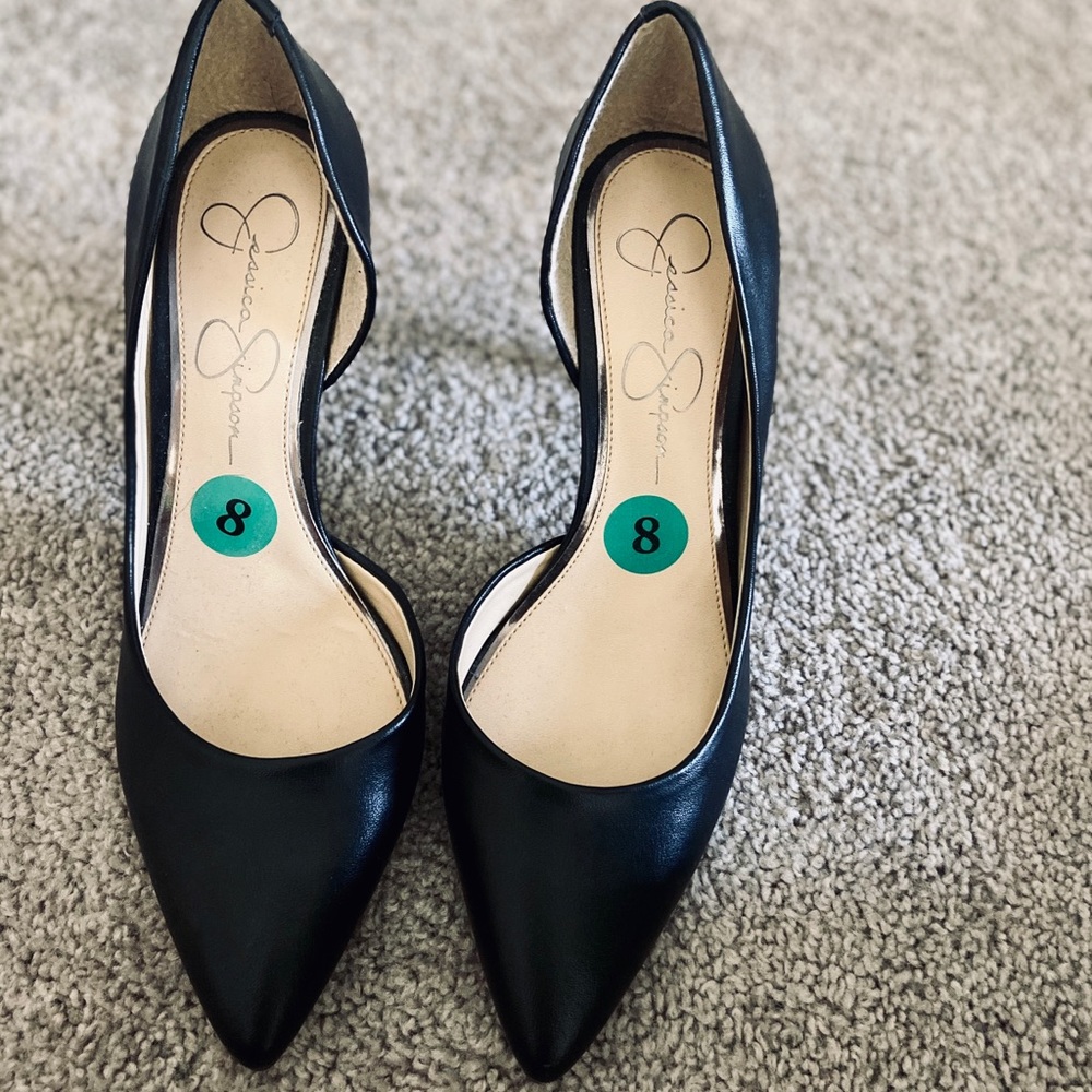 Black faux leather heels.